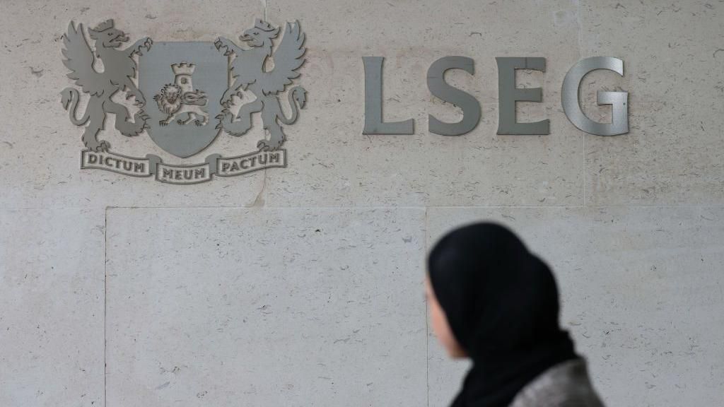Woman in front of the London Stock Exchange building